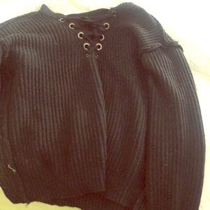 A black tied sweater